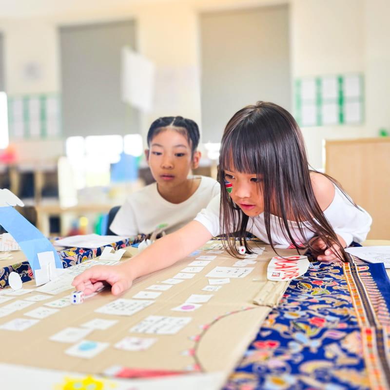 Two students playing a game together