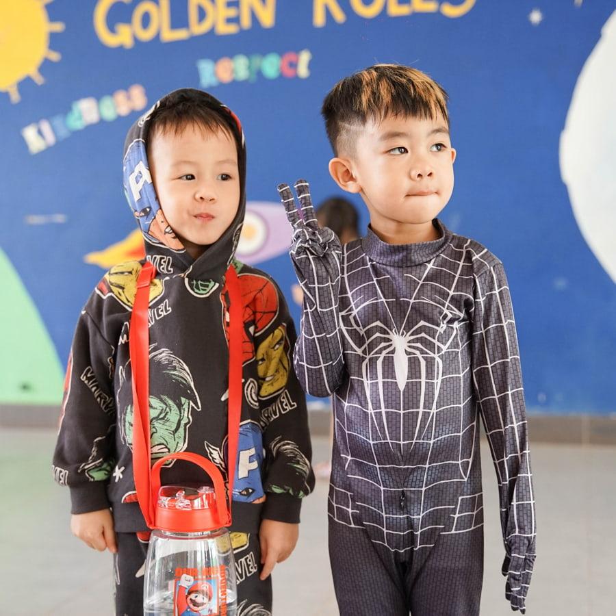 Two young students in super hero costumes