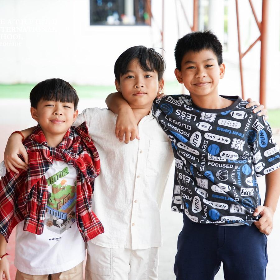 Three students posing in spirit wear