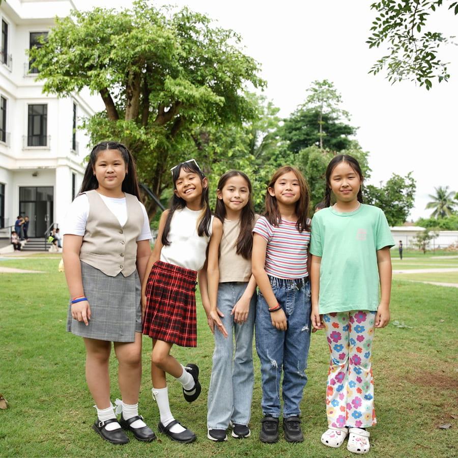 Five students posing in spirit wear