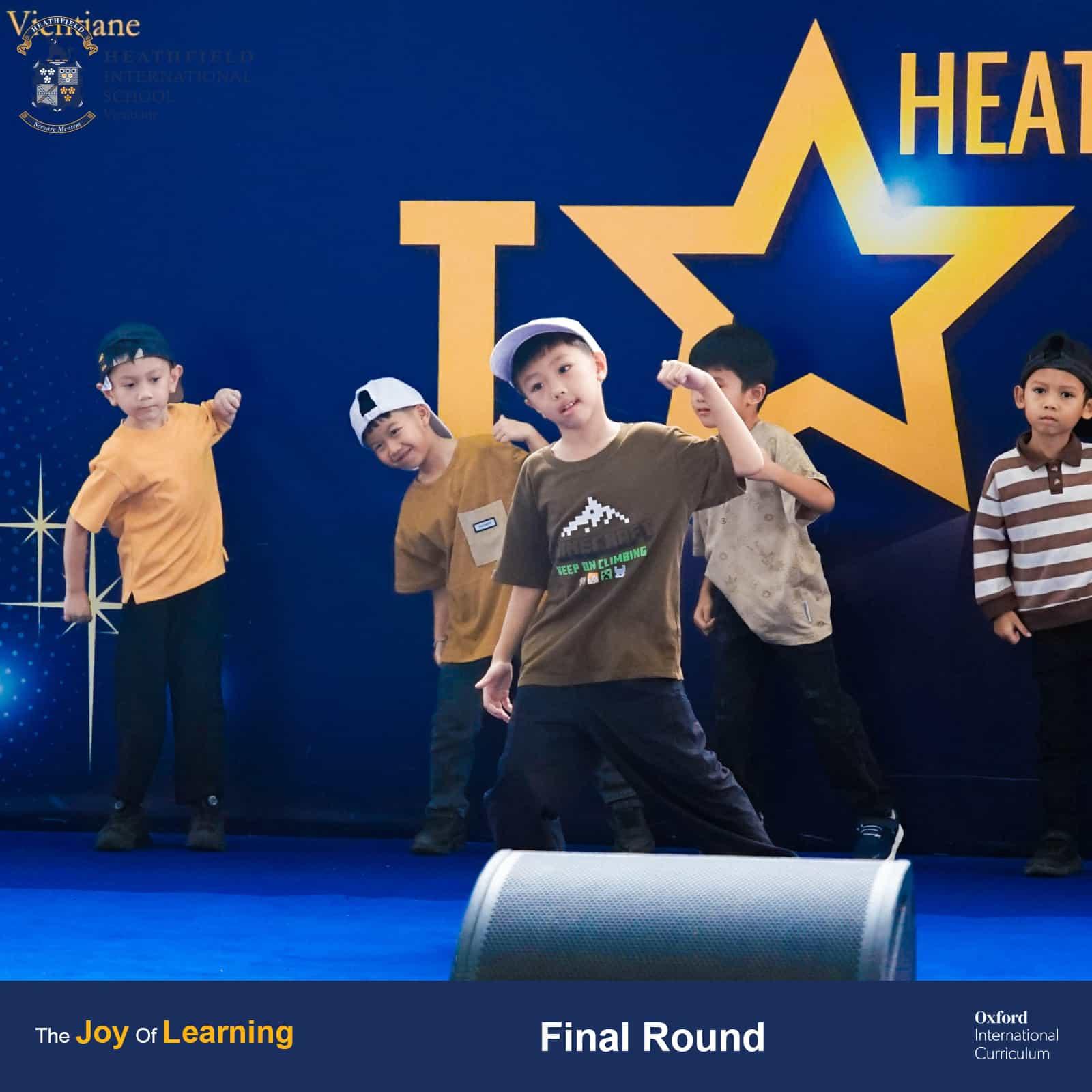 A group of young students performing an energetic choreographed routine during Heathfield's Got Talent finals.